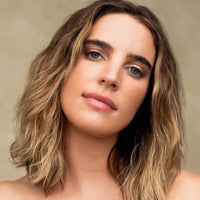 Model with styled wavy hair, Innersense Air Dry Styling Cream