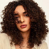 Model with curly hair, Innersense Overnight Repair Serum