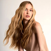 Model with long wavy hair, Innersense Overnight Repair Serum